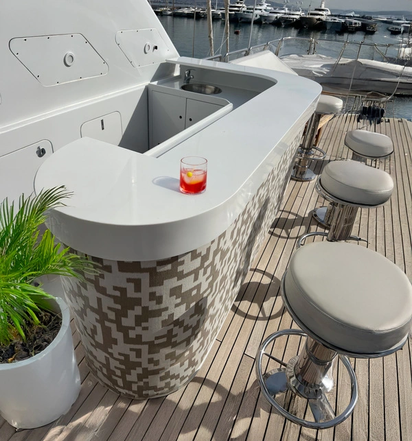 bar with chairs on the deck of a yacht